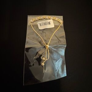 Slider adjustable gold bracelet with silver hearts